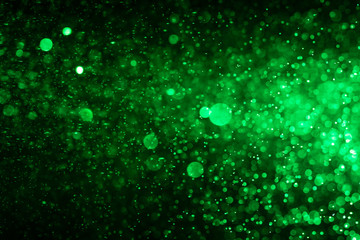 Wall Mural - Abstract Green bokeh defocus glitter blur Background.