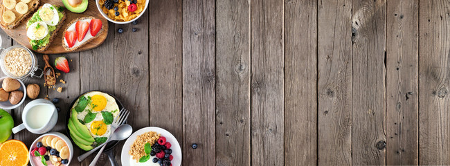 Sticker - Healthy breakfast food banner with side border. Table scene with fruit, yogurt, smoothie bowl, nutritious toasts, cereal and egg skillet. Top view over a rustic wood background. Copy space.