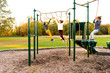 © Sarah Rypma - Young girls crossing the monkey bars at a park playground