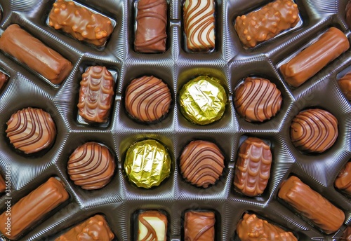 Fotomural many chocolate candies in the box