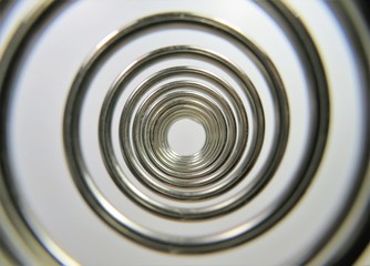 Wall Mural - looking through a metal spiral