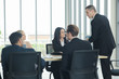 © themorningglory - Various nationality businessmen and business women team discussion in modern office
