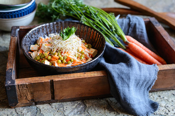 Wall Mural - Easy vegan salad with boiled green peas, fresh parsley root slices and carrot, smoked tofu and topped with Alfalfa sprouts