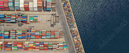 Fotomural Aerial drone ultra wide top down photo of commercial container terminal with cra