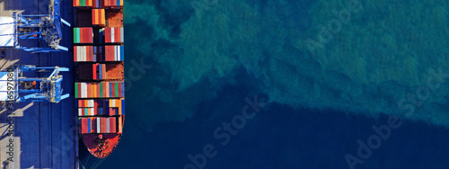 Fotomural Aerial drone ultra wide top down photo of commercial container terminal with cra