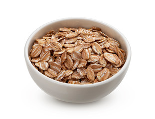 Wall Mural - Oat rye flakes in bowl isolated on white background