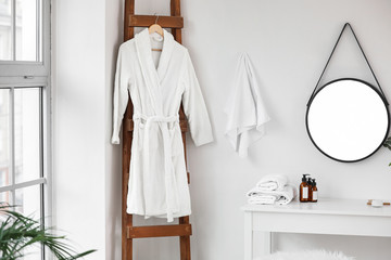 Poster - Soft clean bathrobe in light bathroom