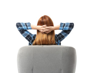 Beautiful woman relaxing in armchair against white background, back view