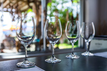 Side By Side Various Sizes Of Wine Empty Glasses On A Restaurant Table Selective Focus View, Goblets For Drink And Taste Wines, Tasting Room Stemware