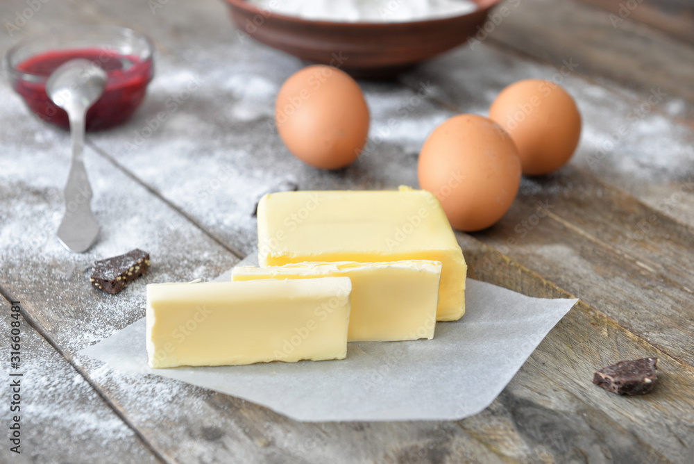 Fresh butter on wooden table