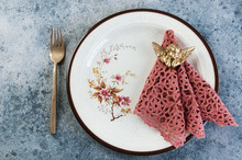 Vintage Dish With Crochet Napkin On Concrete