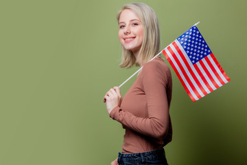 Beautiful cowgirl with United States of America flag