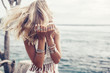 © Alena Ozerova - Boho model wearing crochet top and silver jewelry on the beach