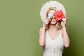 Wall Mural - Beautiful blonde girl with money and gift box