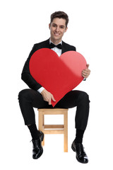 Sticker - smiling fashion model holding big red heart