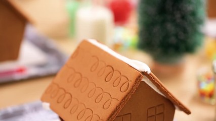 Canvas Print - Kids party to decorate small gingerbread houses  with candies.