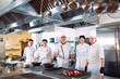 © davit85 - Five chefs wearing uniforms posing in a kitchen .