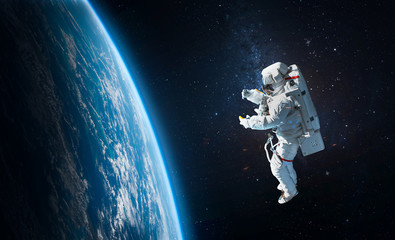 Leinwandbilder - Astronaut in the outer space over the planet Earth. Abstract wallpaper. Spaceman. Elements of this image furnished by NASA