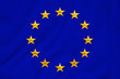 © kittyfly - European Union flag, symbol of united Europe on soft silk with soft folds, close-up