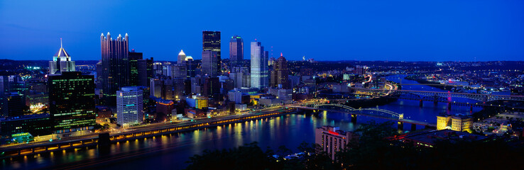 Wall Mural - This is the Allegheny and Monongahela Rivers where they meet the Ohio River at dusk. This is the view from Mount Washington.