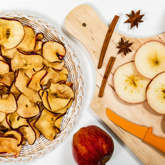 Wall Mural - Baked Cinnamon Red Apple Chips. Selective focus.