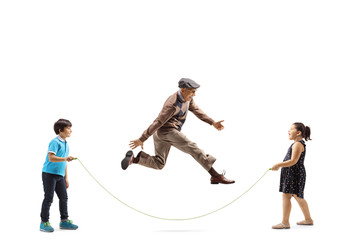 Wall Mural - Children and an elderly man playing skipping rope