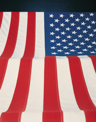 Wall Mural - This is a vertical view of the American flag. The field of stars is at the upper left hand corner with the stars coming toward the viewer at the bottom.