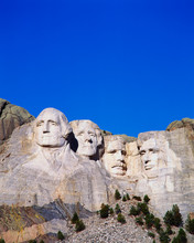 This Is A Vertical Image Of Mount Rushmore National Monument Showing The Four Faces Of George Washington, Thomas Jefferson, Theodore Roosevelt, And Abraham Lincoln.