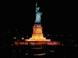 Wall Mural - This is the Statue of Liberty lit up at night on Liberty Weekend. It was taken from the Aircraft Carrier Kennedy.