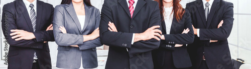 Fotomural Successful professional group of business people man and woman team standing fol