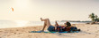 © olezzo - Young woman lying with smart phone on a beach. Relaxation concept