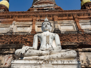 Wall Mural - Thai architecture Ancient times,Most materials are brick and mortar,forming a wall and floor,The surrounding area has a beautiful Buddha statue,On the bright day