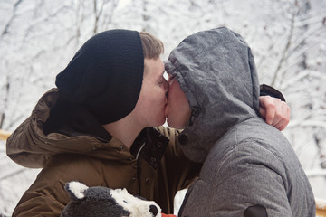 Winter and mountains. Young couple on vacation.