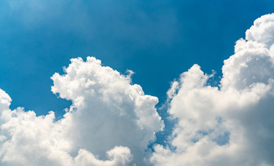 Beautiful blue sky and white cumulus clouds abstract background. Cloudscape background. Blue sky and fluffy white clouds on sunny day. Nature weather. Bright day sky for happy day background.