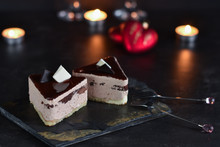 Chocolate Cakes On A Dark Background With Candles