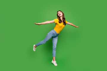 Poster - Full length body size view of her she nice attractive lovely pretty slim fit dreamy cheerful cheery wavy-haired girl having fun flying isolated on bright vivid shine vibrant green color background