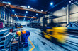 © Photocreo Bednarek - Factory work. Forklift moving and a worker taking a steel profile