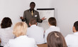 © JackF - African American man speaking to physicians in conference room