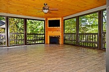 Enclosed Porch With TV And Fireplace