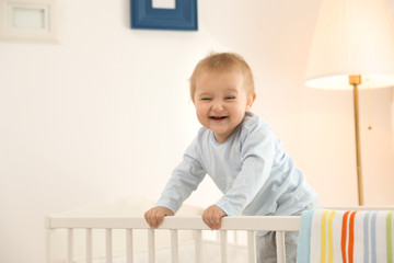 Wall Mural - Cute little baby in crib at home