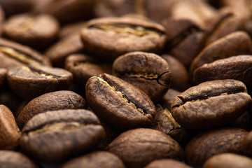 Coffee beans close-up background. Fresh roasted