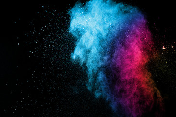 explosion of colored powder isolated on black background. abstract colored background. holi festival