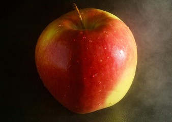 red apple on black background