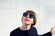 © ottochka - Portrait of a talking short-haired woman in sunglasses