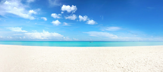 beautiful beach with white sand, turquoise ocean and blue sky with clouds in sunny day. panoramic vi