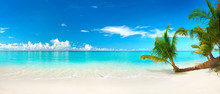 Beautiful Beach With White Sand, Turquoise Ocean, Blue Sky With Clouds And Palm Tree Over The Water On A Sunny Day. Maldives, Perfect Tropical Landscape, Ultra Wide Format.