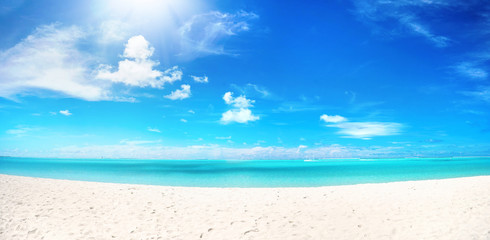 Wall Mural - beautiful beach with white sand, turquoise ocean water and blue sky with clouds in sunny day. panora