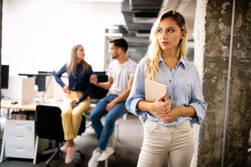 Wall Mural - Beautiful business woman holding tablet computer in office