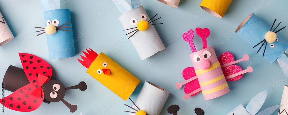 Happy easter kindergarten decoration concept - rabbit, chicken, egg, bee from toilet paper roll tube. Simple diy creative idea. Eco-friendly reuse recycle banner, daycare paper craft - obrazy, fototapety, plakaty 