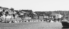 Whitby, North Yorkshire, England - Jan 28, 2019:,UK - Black And White Photo  Of The Harbour At Whitby On The North Yorkshire Coast, Fishing Boats Tied Up To The Quay In Whitby Harbour